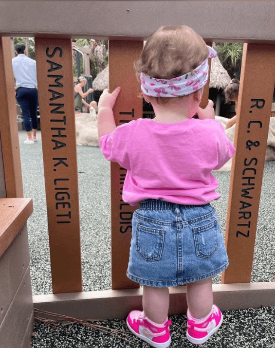 Baby girl is wearing a comfortable baby headband for little girls from By Bella Boutique. Baby girl is wearing a comfortable baby headband for little girls from By Bella Boutique.