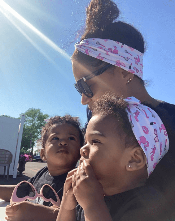 Baby girl is wearing a knotted headband featuring a barbie print for little girls from By Bella Boutique. Baby girl is wearing a knotted headband featuring a barbie print for little girls from By Bella Boutique.