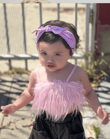 Baby girl is wearing a soft baby headband for little girls from By Bella Boutique. Baby girl is wearing a soft baby headband for little girls from By Bella Boutique.