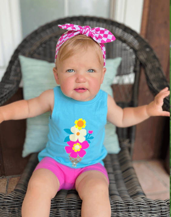 Little girl is wearing a comfortable baby headband for little girls from By Bella Boutique. Little girl is wearing a comfortable baby headband for little girls from By Bella Boutique.