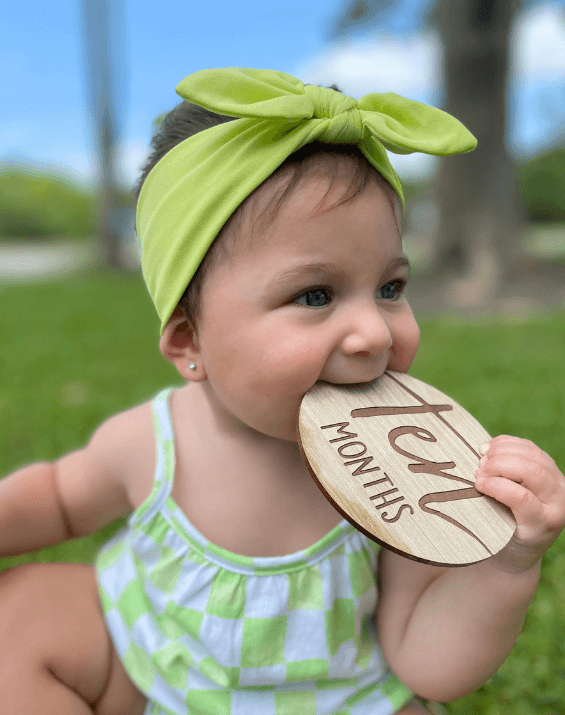 Baby girl is wearing a baby headband for little girls from By Bella Boutique. Baby girl is wearing a baby headband for little girls from By Bella Boutique.