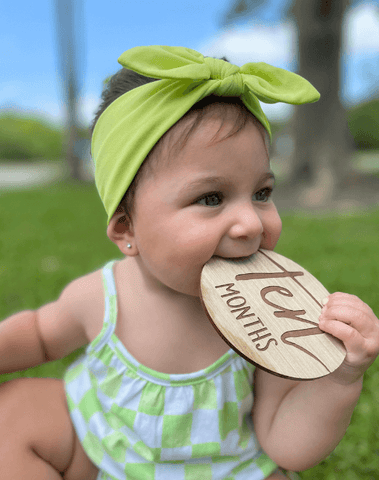 Baby girl is wearing a baby headband for little girls from By Bella Boutique. Baby girl is wearing a baby headband for little girls from By Bella Boutique.