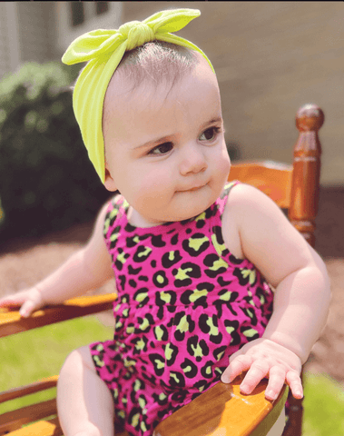 Baby girl is wearing a baby head wrap for little girls from By Bella Boutique. Baby girl is wearing a baby head wrap for little girls from By Bella Boutique.