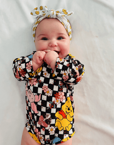 Little girl is wearing a soft baby headband for little girls from By Bella Boutique. Little girl is wearing a soft baby headband for little girls from By Bella Boutique.