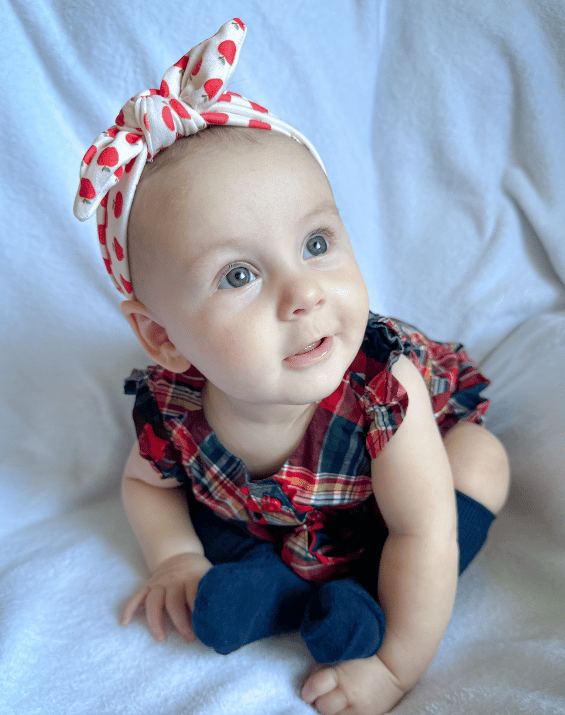 Little girl is wearing a baby head wrap for little girls from By Bella Boutique. Little girl is wearing a baby head wrap for little girls from By Bella Boutique.