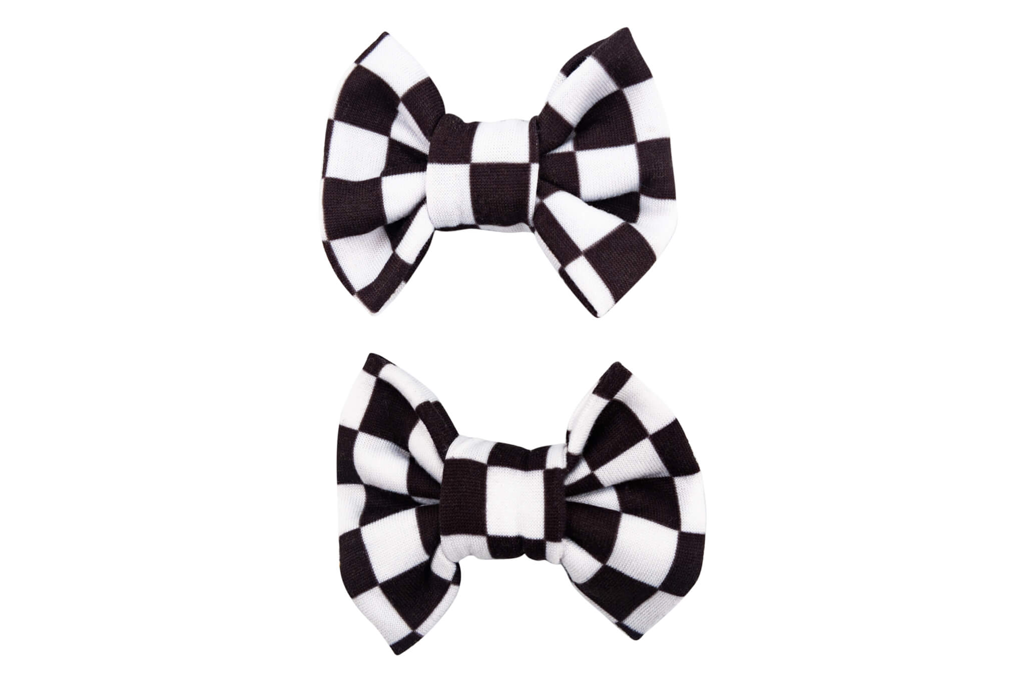 A set of two pigtail bows for toddler girls featuring a white checkerboard pattern from By Bella Boutique. A set of two pigtail bows for toddler girls featuring a white checkerboard pattern from By Bella Boutique.