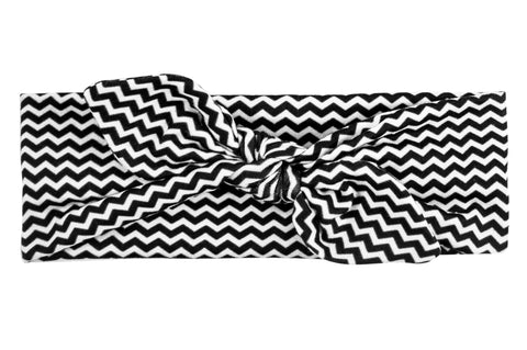 Black and white chevron print baby headband from By Bella Boutique. Black and white chevron print baby headband from By Bella Boutique.