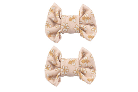 A set of two handmade bow clips featuring a boho print for little girls from By Bella Boutique. A set of two handmade bow clips featuring a boho print for little girls from By Bella Boutique.