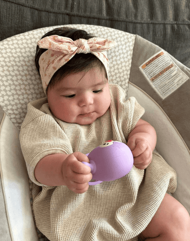 Baby girl is wearing a soft baby headband for little girls from By Bella Boutique. Baby girl is wearing a soft baby headband for little girls from By Bella Boutique.