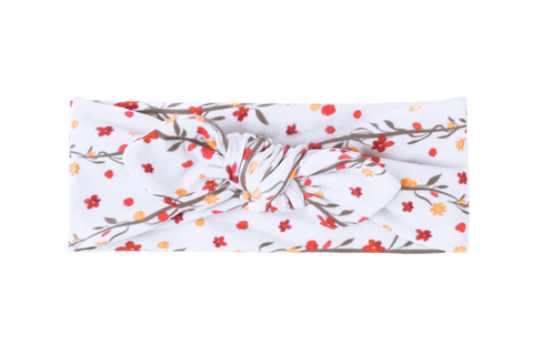 a baby flower headband featuring a rose pattern from by bella botutique a baby flower headband featuring a rose pattern from by bella botutique
