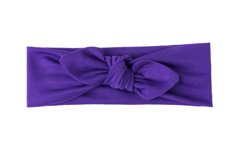 A purple top knot headband for little girls from By Bella Boutique  A purple top knot headband for little girls from By Bella Boutique