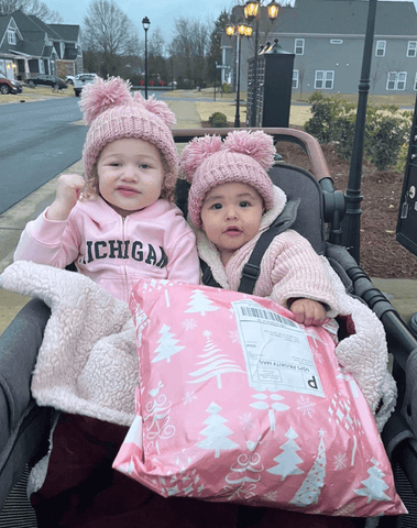 Little girls are wearing handmade beanies from By Bella Boutique. Little girls are wearing handmade beanies from By Bella Boutique.