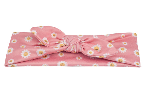 Top knot headband featuring a floral pattern from By Bella Boutique. Top knot headband featuring a floral pattern from By Bella Boutique.