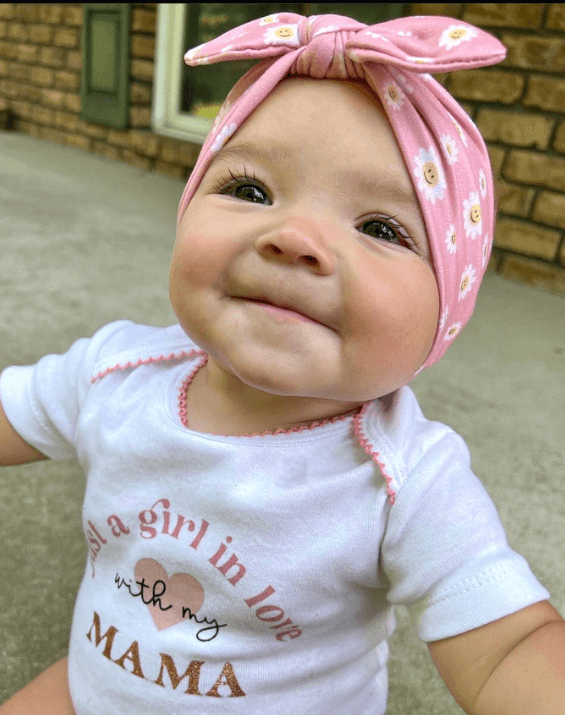 Baby girl is wearing the most comfortable bow from By Bella Boutique. Baby girl is wearing the most comfortable bow from By Bella Boutique.
