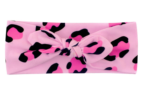 A baby head wrap featuring a pink leopard print fromBy Bella Boutique  A baby head wrap featuring a pink leopard print fromBy Bella Boutique
