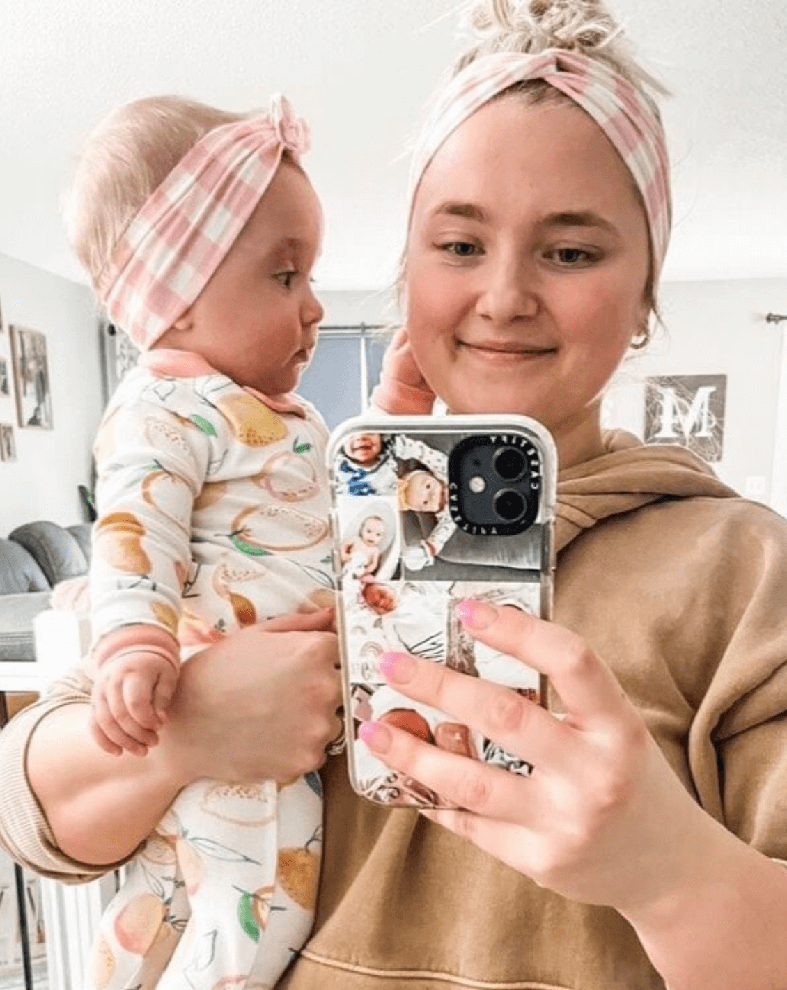 Mom and daughter are wearing matching headbands featuring a pink gingham print from By Bella Boutique. Mom and daughter are wearing matching headbands featuring a pink gingham print from By Bella Boutique.