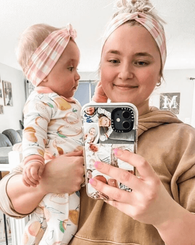 Mom and daughter are wearing matching headbands featuring a pink gingham print from By Bella Boutique. Mom and daughter are wearing matching headbands featuring a pink gingham print from By Bella Boutique.