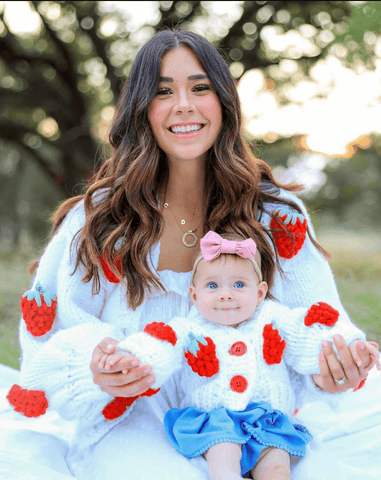 Baby girl is wearing a pink nylon band for newborns from By Bella Boutique. Baby girl is wearing a pink nylon band for newborns from By Bella Boutique.