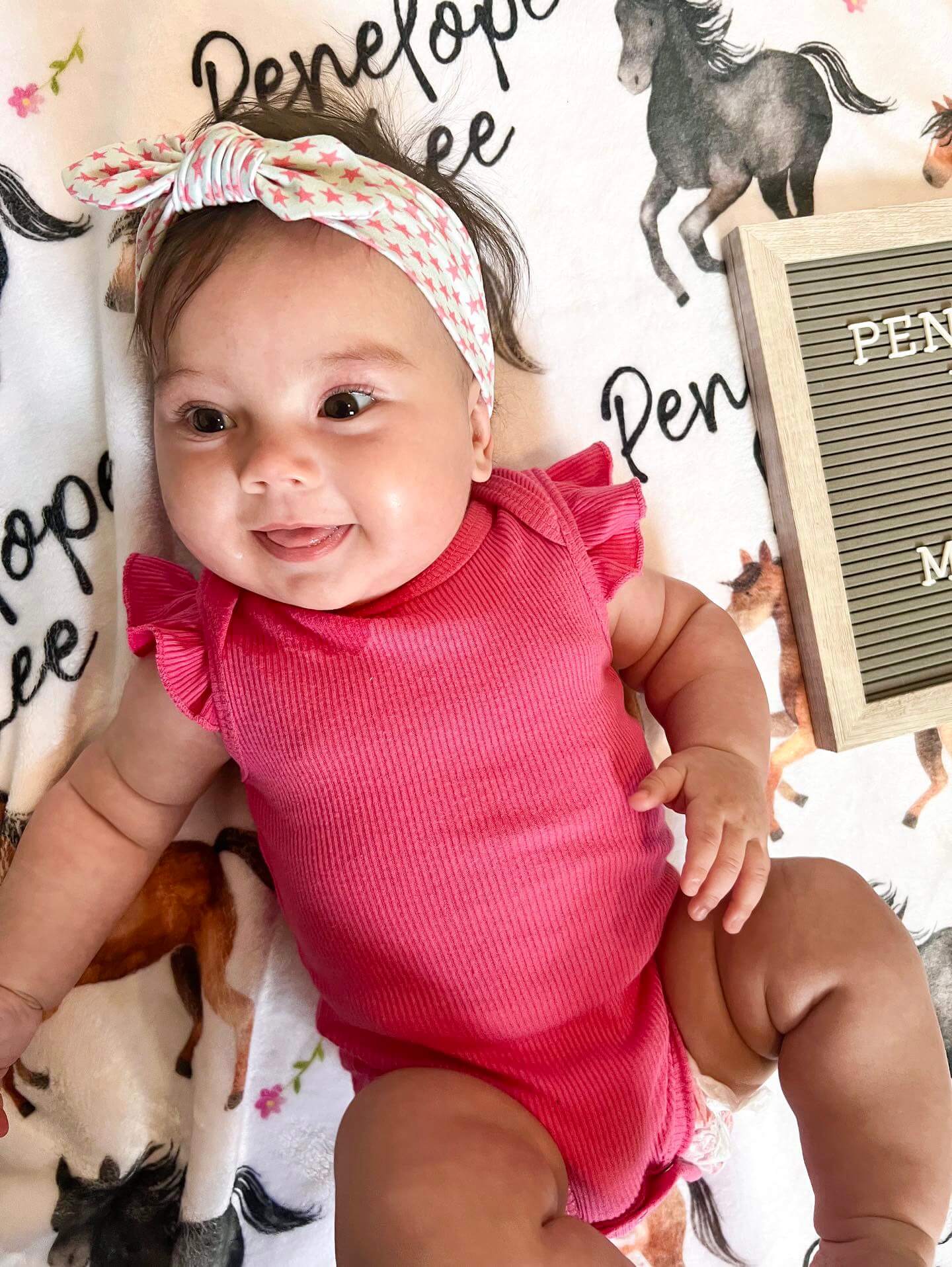Little girl is wearing a top knot headband for little girls from By Bella Boutique. Little girl is wearing a top knot headband for little girls from By Bella Boutique.