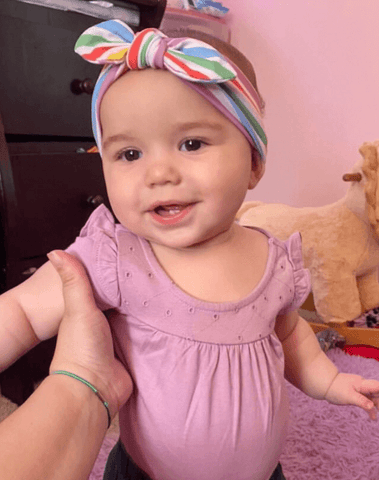 Baby girl is wearing the most comfortable headband for little girls from By Bella Boutique. Baby girl is wearing the most comfortable headband for little girls from By Bella Boutique.