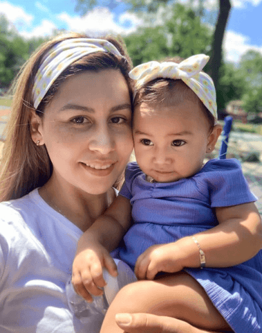 Mom and baby girl are wearing matching mommy and me headbands from By Bella Boutique. Mom and baby girl are wearing matching mommy and me headbands from By Bella Boutique.