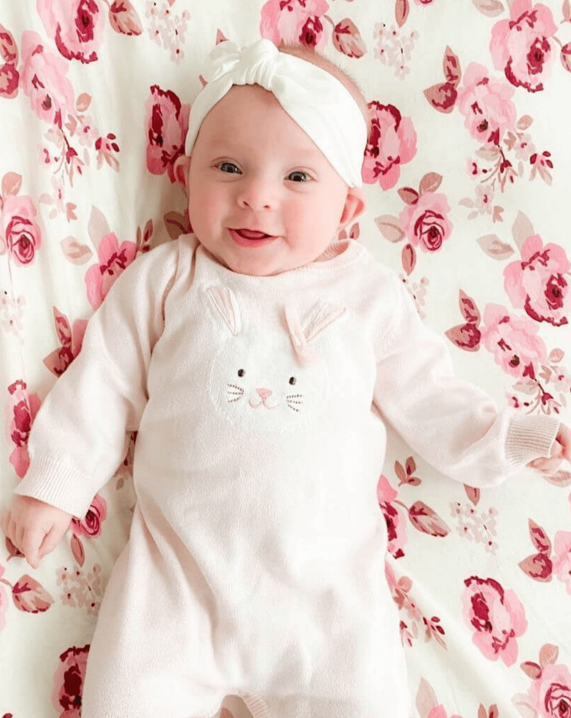 Baby girl is wearing a white baby head wrap for girls from By Bella Boutique. Baby girl is wearing a white baby head wrap for girls from By Bella Boutique.