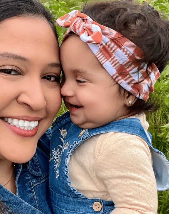 Baby girl is wearing a baby headband for little girls form By Bella Boutique.