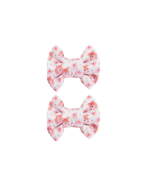 Handmade set of 2 soft white watercolor unicorn print bow clips front view for toddlers and little girls by By Bella Boutique