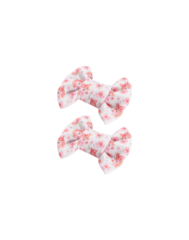 Handmade set of 2 soft white watercolor unicorn print bow clips angle view for toddlers and little girls by By Bella Boutique