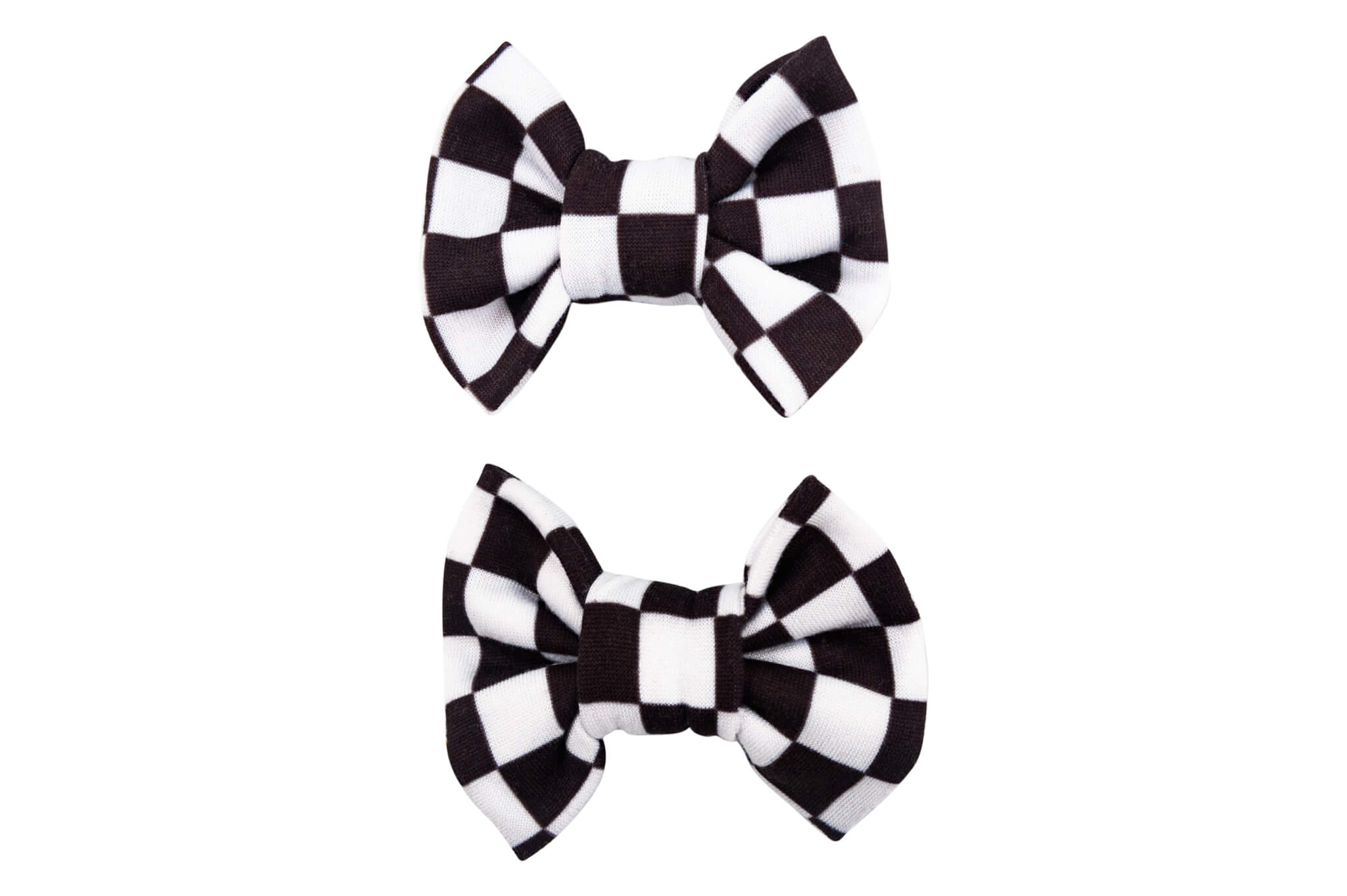 A set of two pigtail bows for toddler girls featuring a white checkerboard pattern from By Bella Boutique.