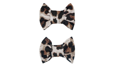 A pair of two bow clips featuring a leopard pattern for toddler girls from By Bella Boutique.