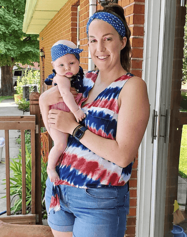 Mom and baby girl are wearing matching mommy and me headbands from By Bella Boutique.
