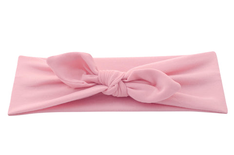 A pink baby head wrap for girls from By Bella Boutique.