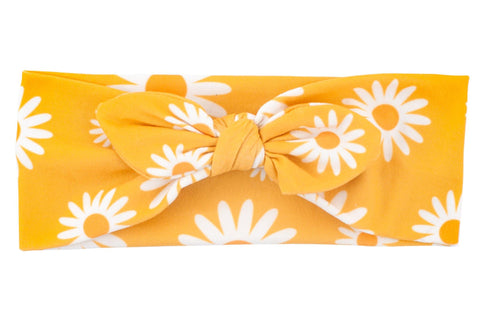 A knotted head wrap for babies featuring a flower pattern from By Bella Boutique.