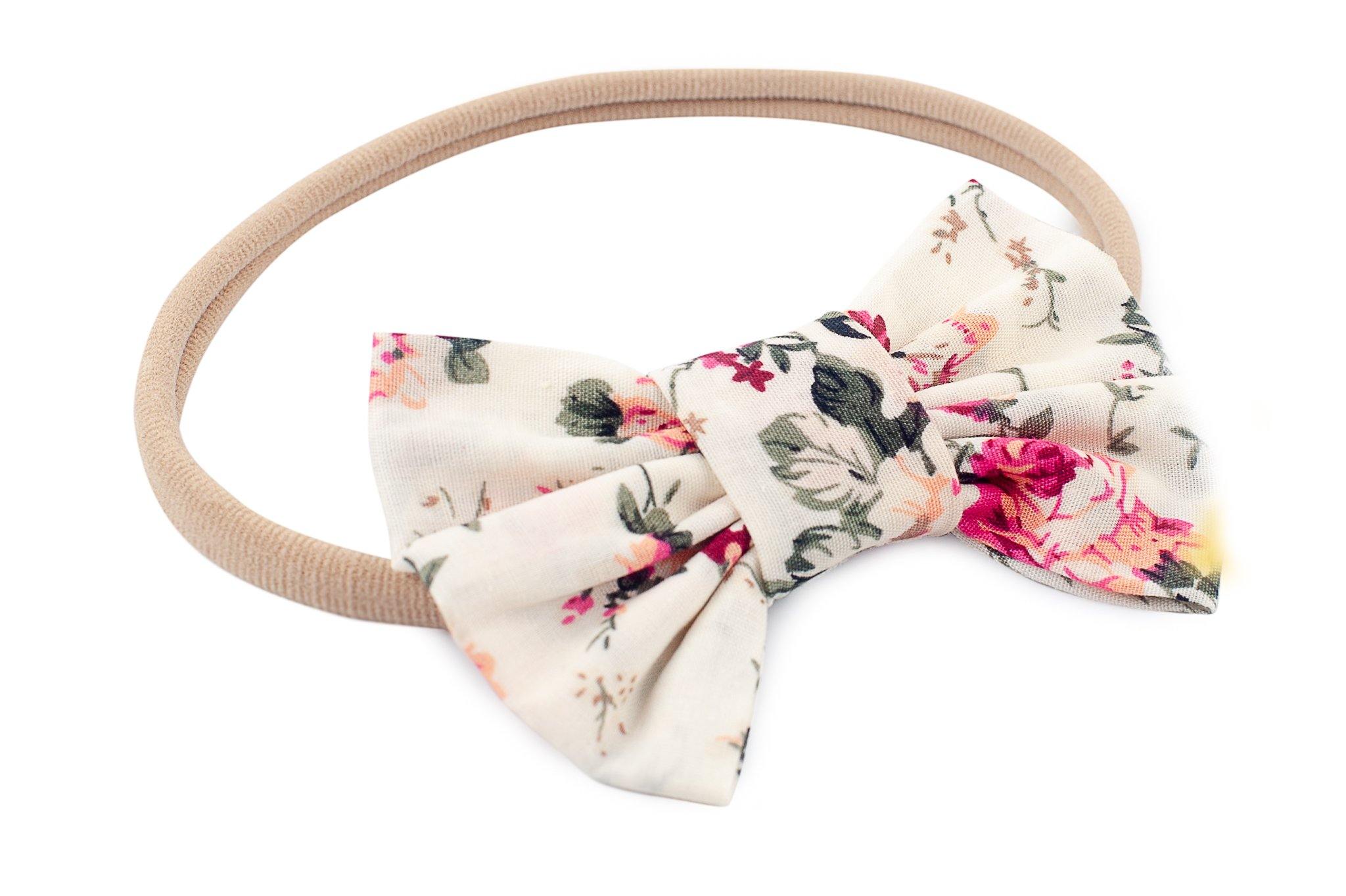 A nylon headband for newborns featuring a floral pattern from By Bella Boutique.