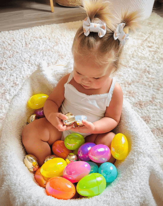 Toddler girl is wearing a set of clip bows for toddler girls from By Bella Boutique.