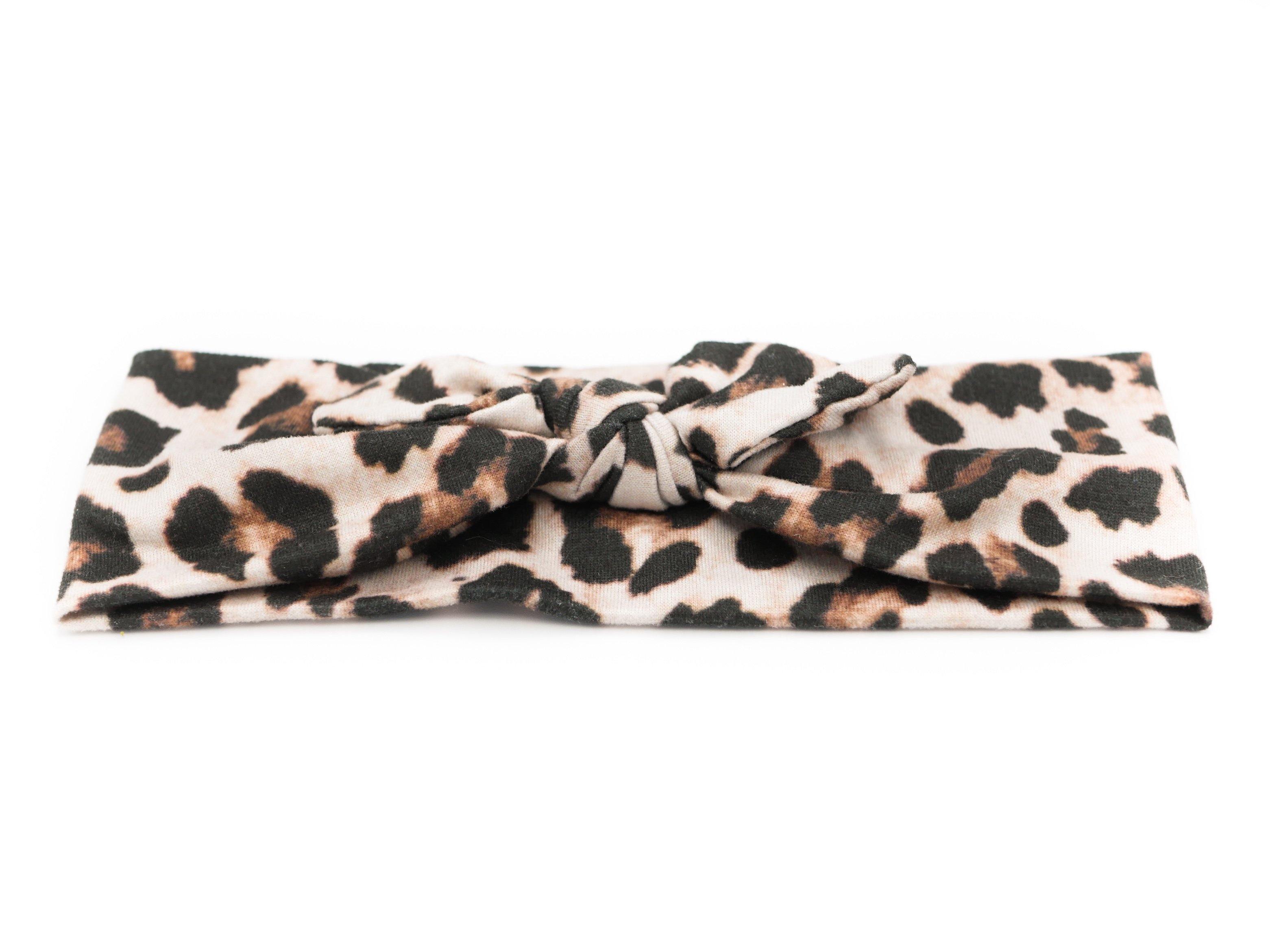 A baby head wrap featuring a leopard print from By Bella Boutique.
