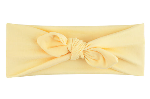 A pastel yellow knotted headband from By Bella Boutique.