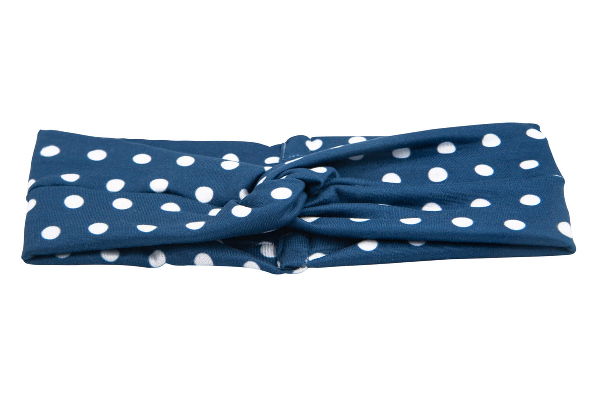Blue polka dot twist headband for women from By Bella Boutique.