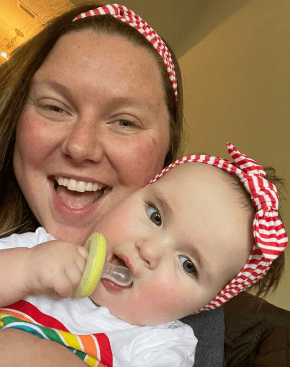 Mom and baby girl are wearing matching mommy and me headbands from By Bella Boutique.
