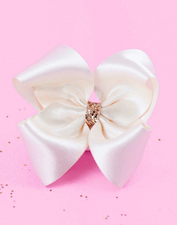 Handmade satin bows for little girls from By Bella Boutique.