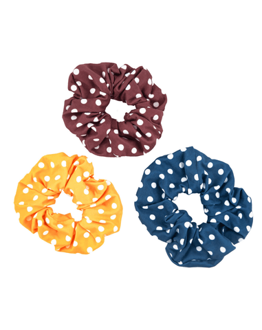 A collection of handmade scrunchies from By Bella Boutique.