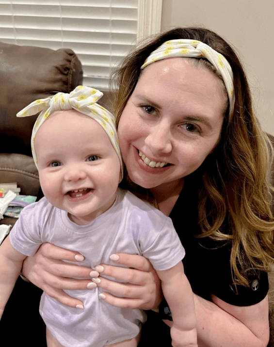 Mom and baby girl wearing matching mommy and me headbands from By Bella Boutique.