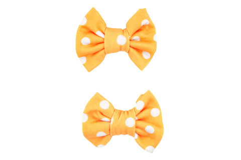Handmade yellow polka dot bow clips for toddler girls from By Bella Boutique. 